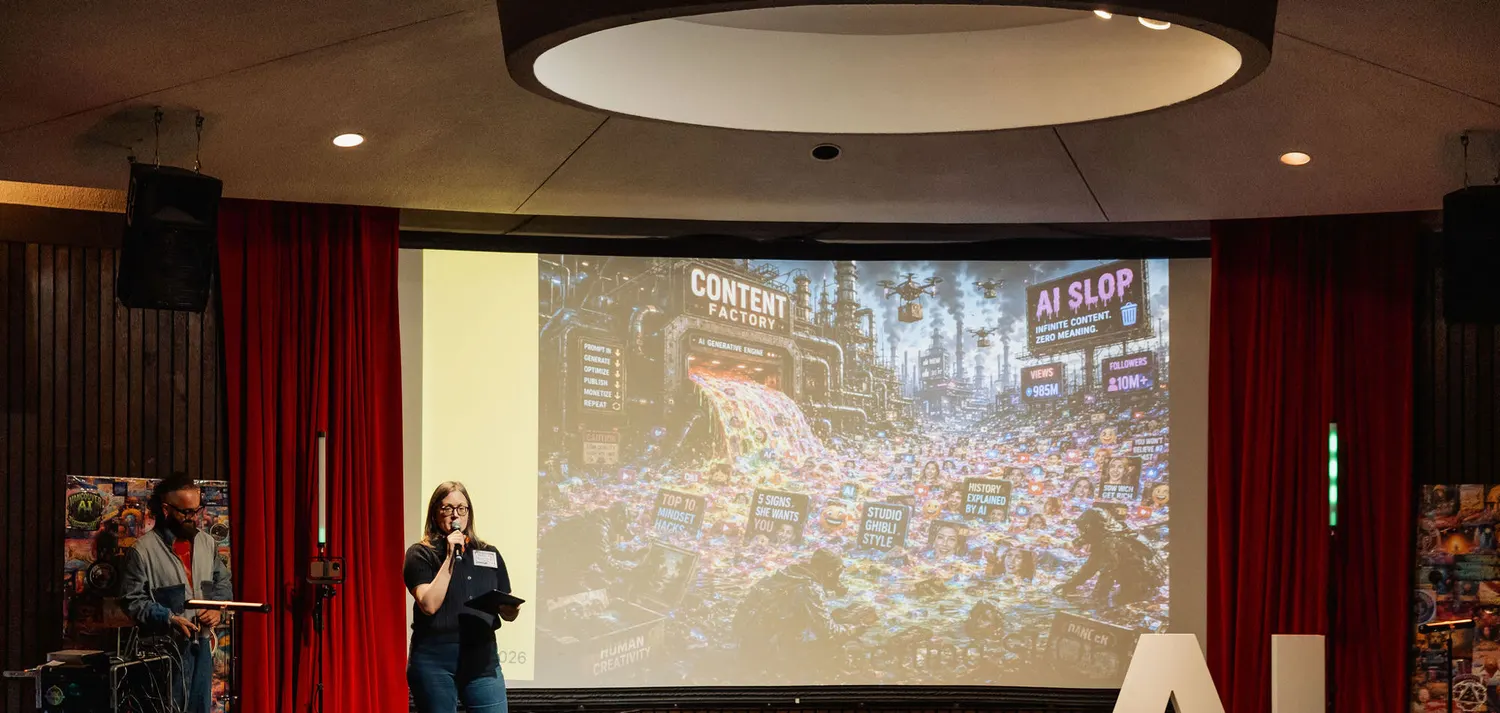 Kris Krüg and Andrea Mills speaking together onstage at Vancouver AI.