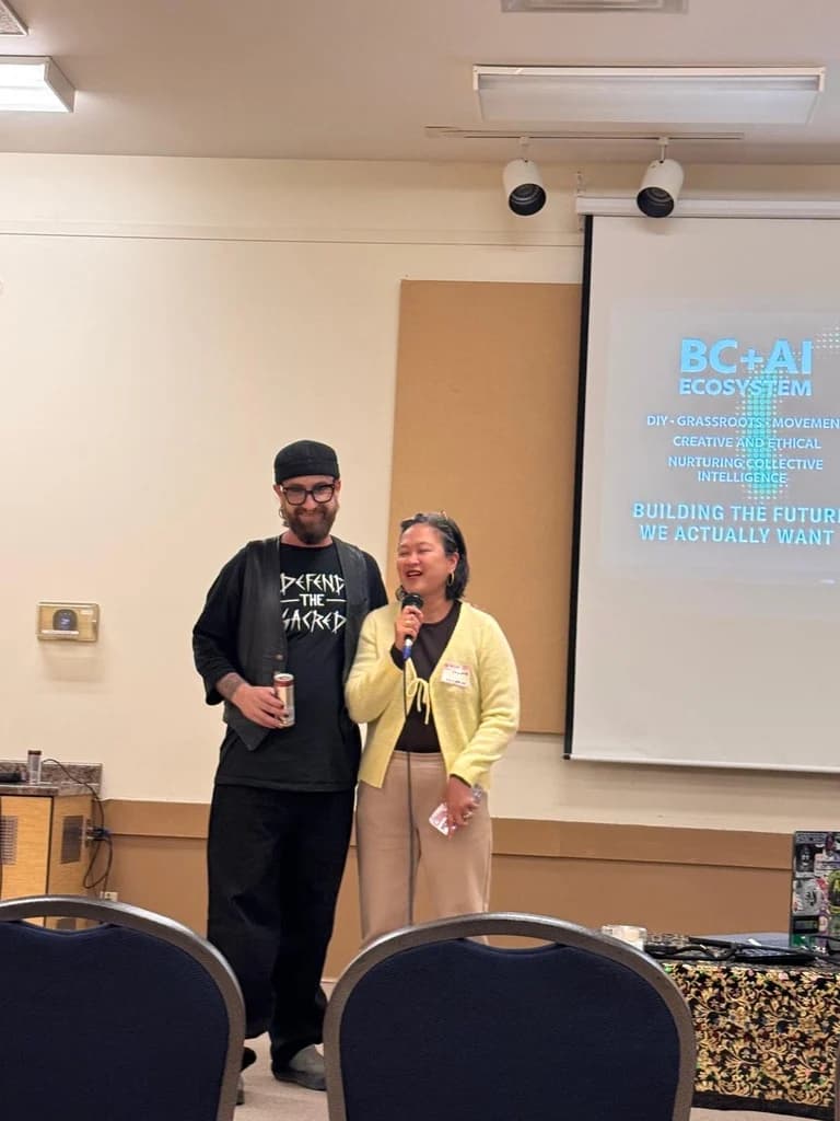 Comox Valley regional lead Lourdes Gant speaking beside BC + AI executive director Kris Krüg.