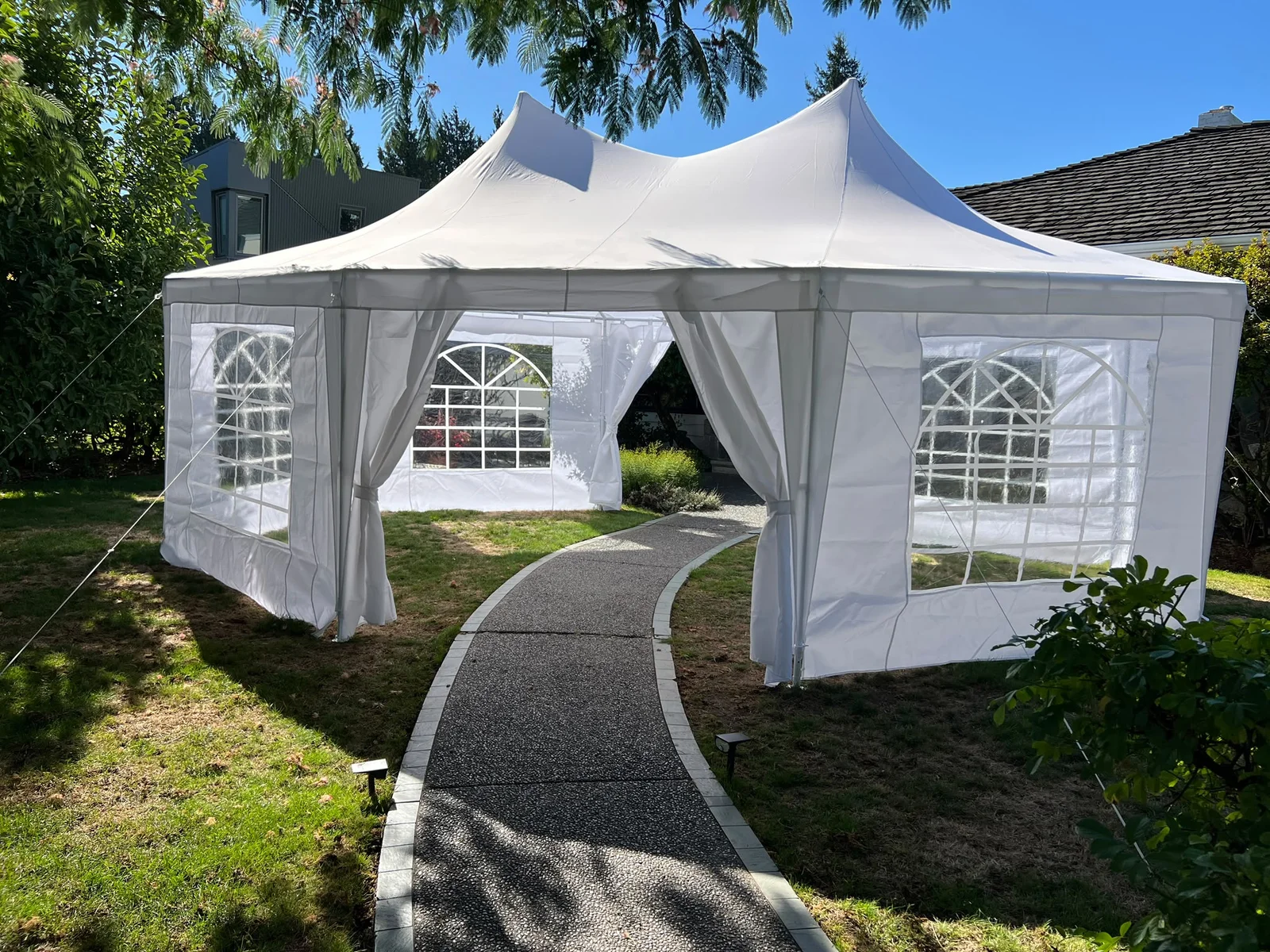 The marquee set up in the backyard for the September 8 AI + Life Sciences supper
