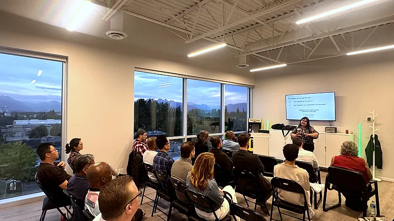 The FV+AI meetup room seen from the back of the audience, with Dr. Alma Barranco-Mendoza presenting at the far end.