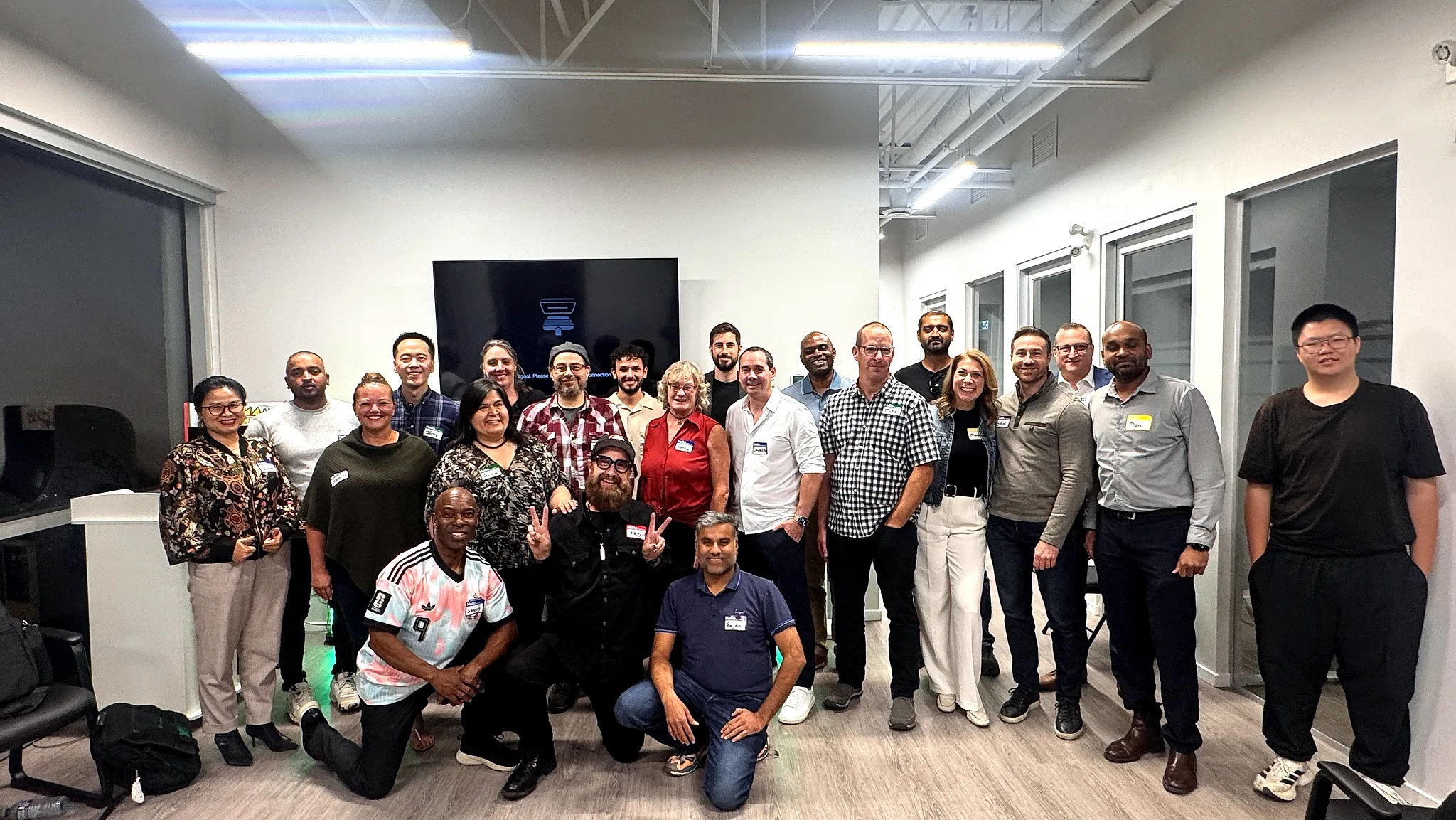 About twenty five attendees of the first FV+AI meetup stand together for a group photo in the Coleman Technologies office in Langley.