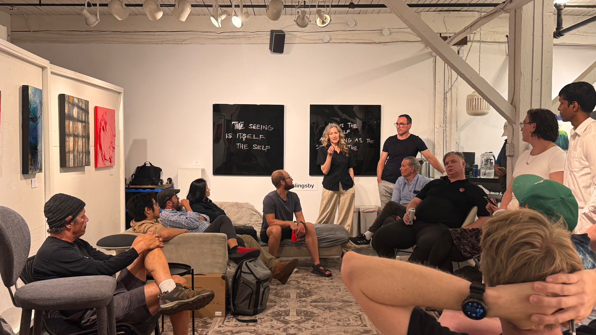 People seated in a discussion circle at an AI Ethical Futures Lab session.