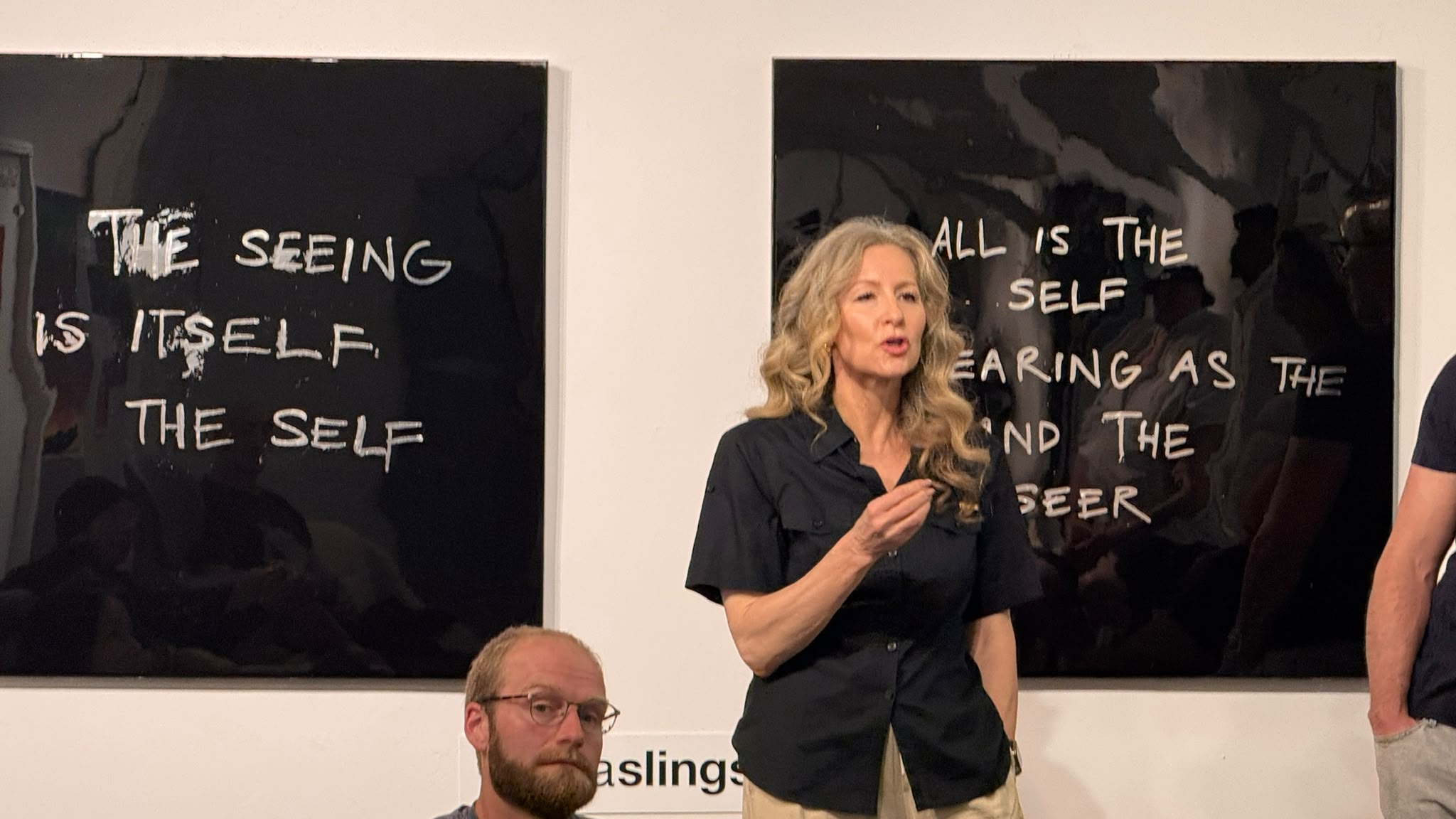 AI Ethical Futures Lab #5 speaker moment in front of gallery works exploring selfhood and perception.