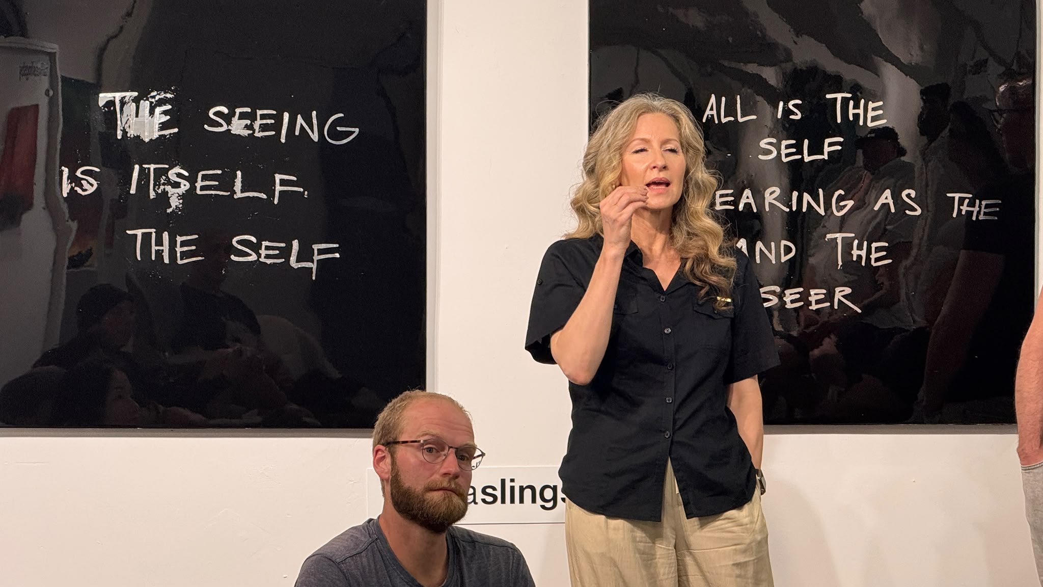 Close discussion moment from AI Ethical Futures Lab #5, with gallery works setting the tone for questions about perception and the self.
