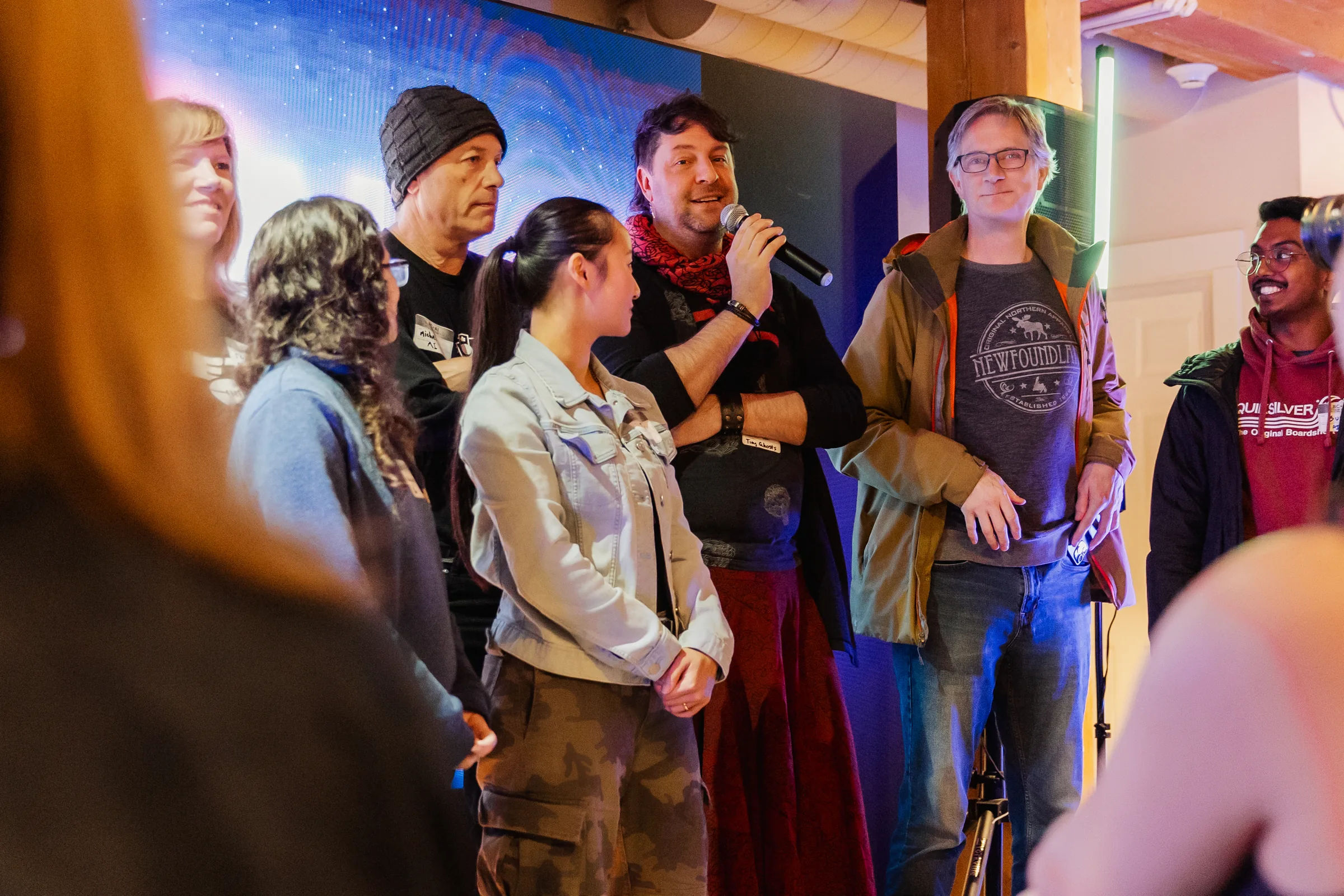 AI Film Club attendees standing together during a community share-out.